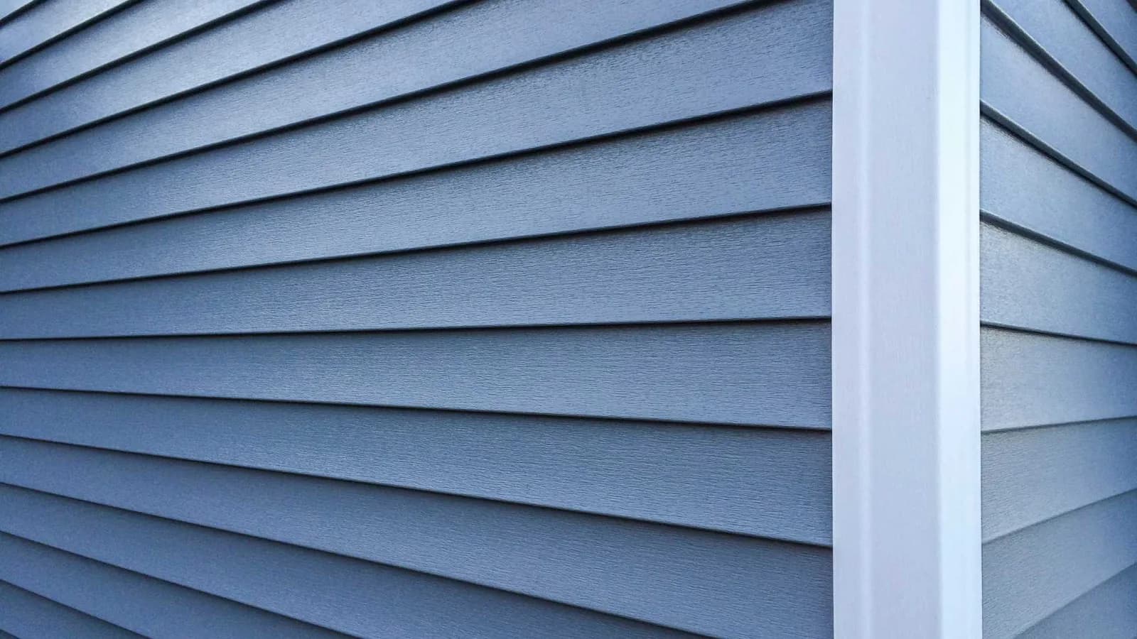 lap siding , blue-grey color with white trim