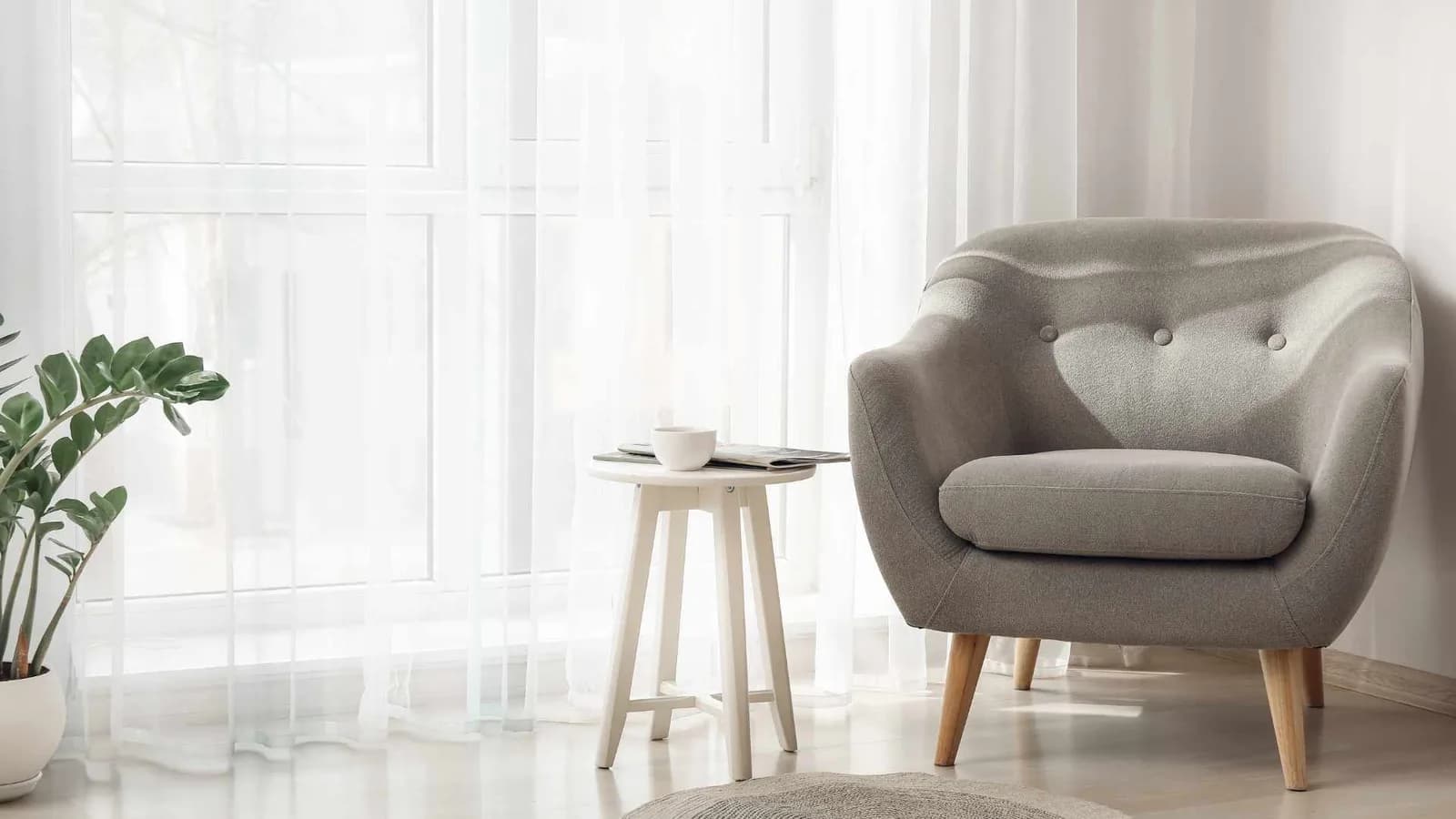 Arm chair and sheer curtains