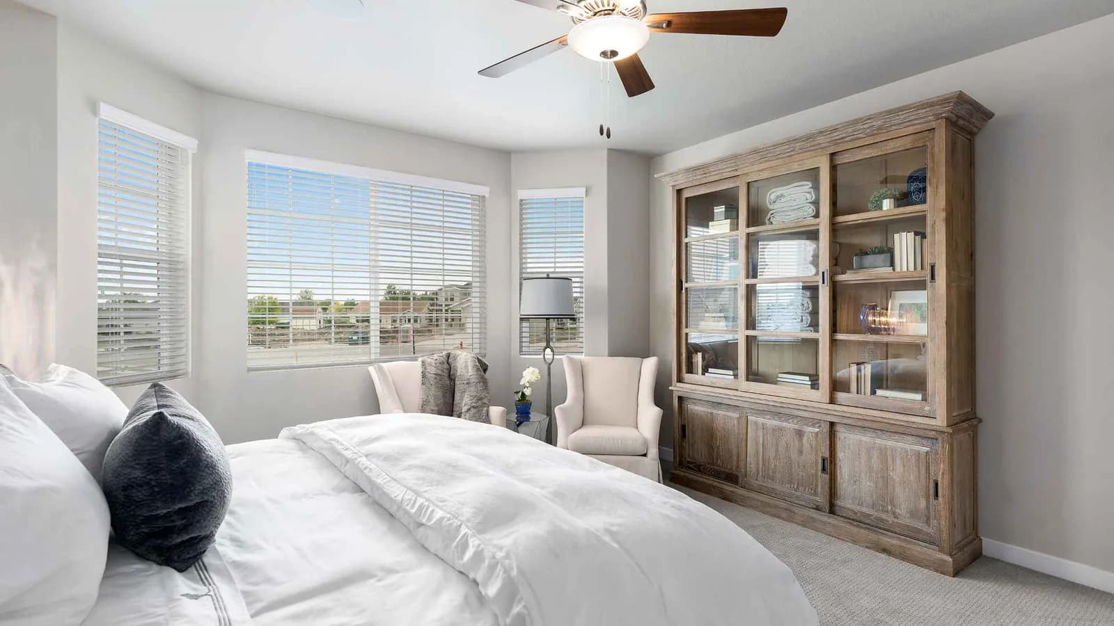 Bedroom with cabinet and fan