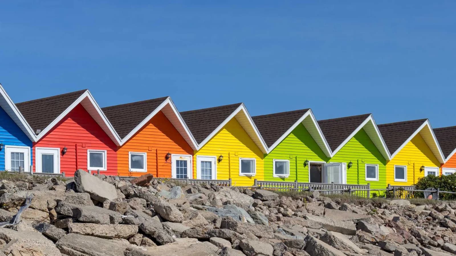 Row of colorful cottages side by side