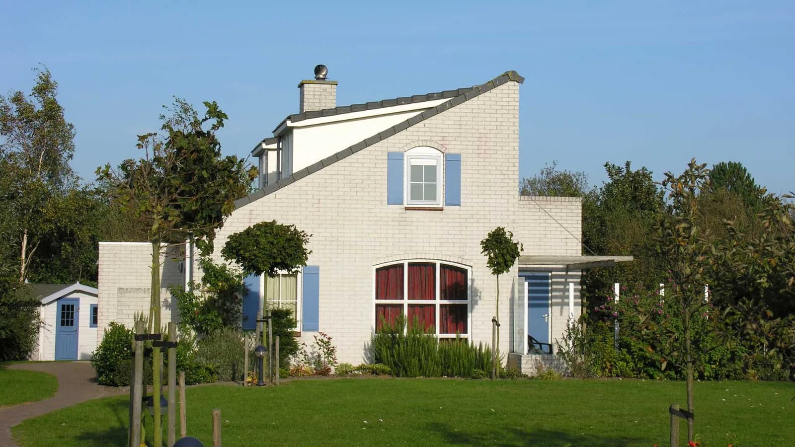 White brick cottage exterior with rustic charm