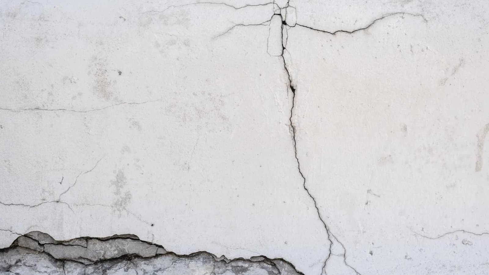 cracks in the stucco wall