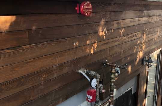 Fire alarm system with sprinklers on a house