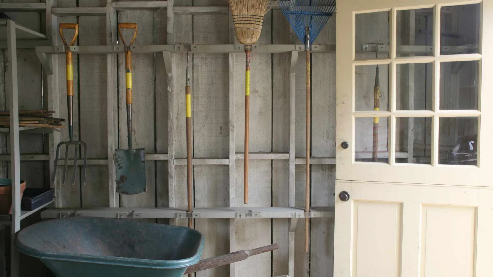 Garden tools and equipment stored inside a shed