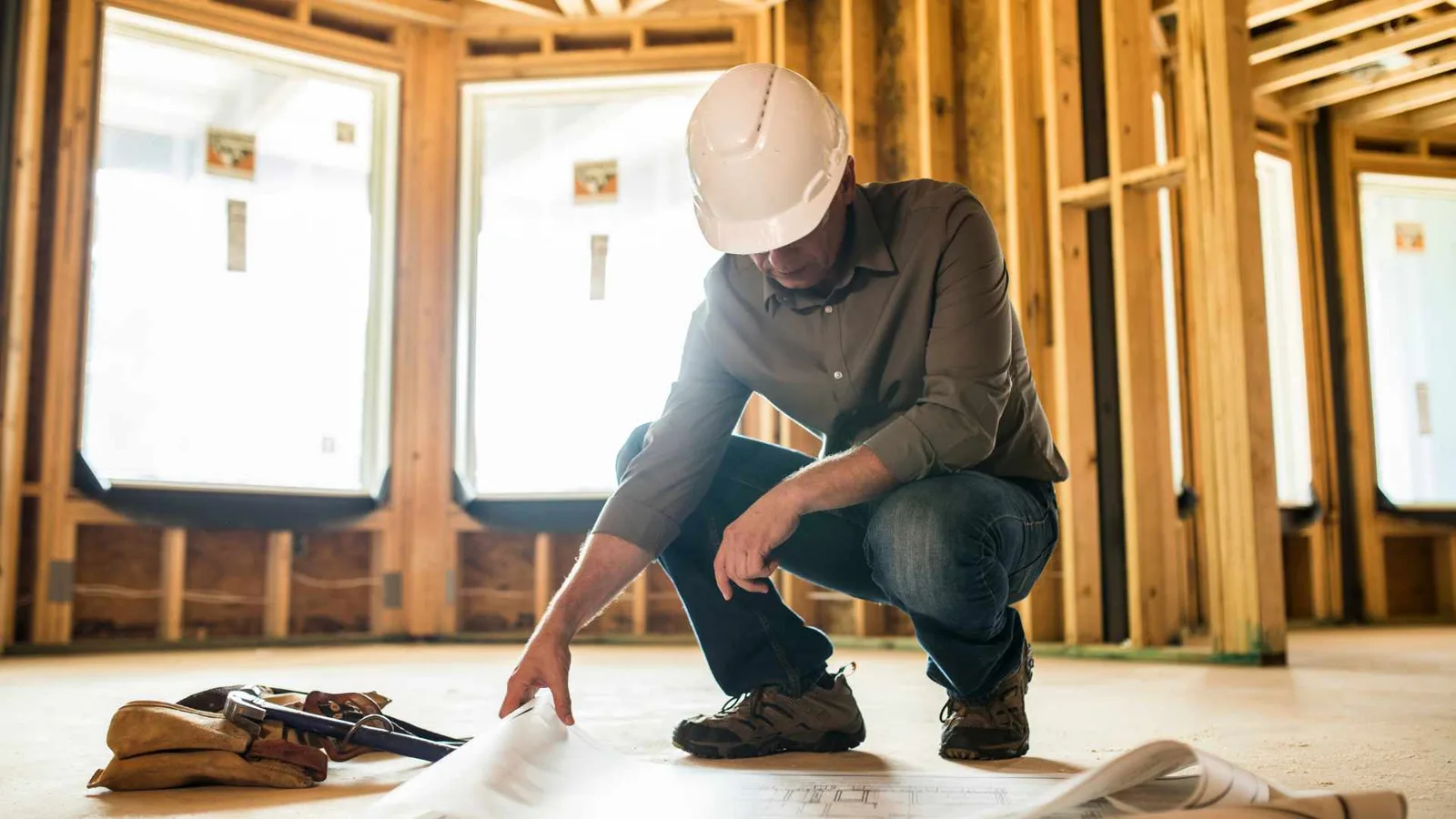general contractor looking at building plans
