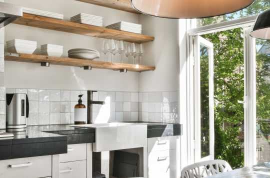 Kitchen with black and wood accents