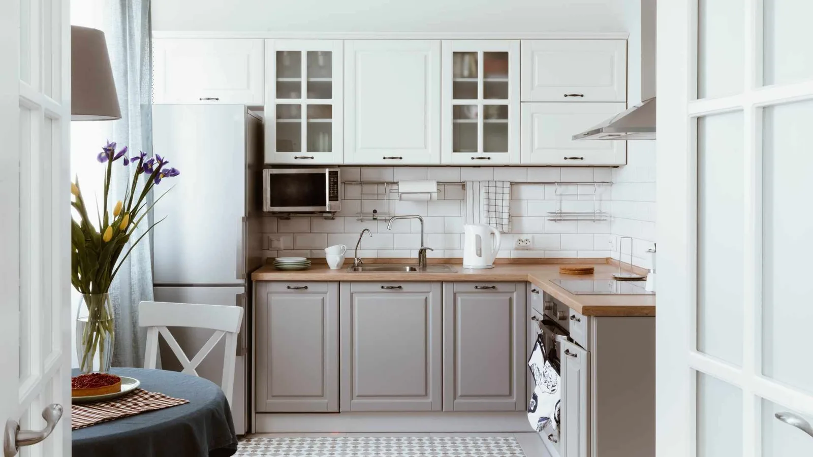 Kitchen with small dining area in a 500 sq ft ADU
