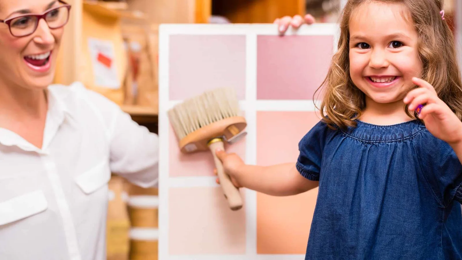 Little girls with a paint brush