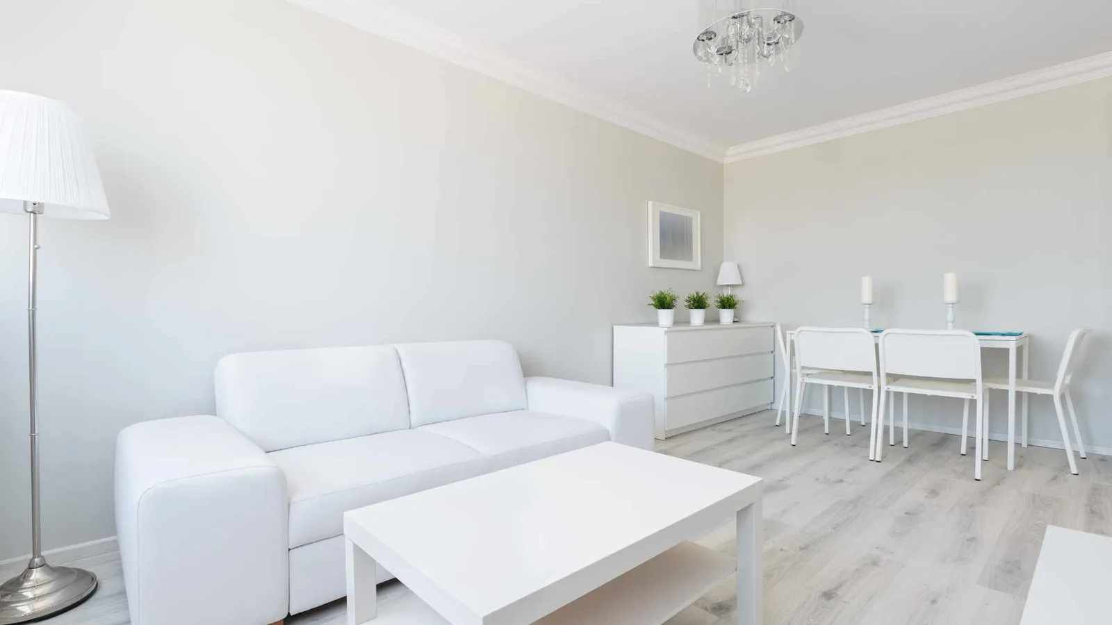Minimalist living room with white walls and simple furnishings
