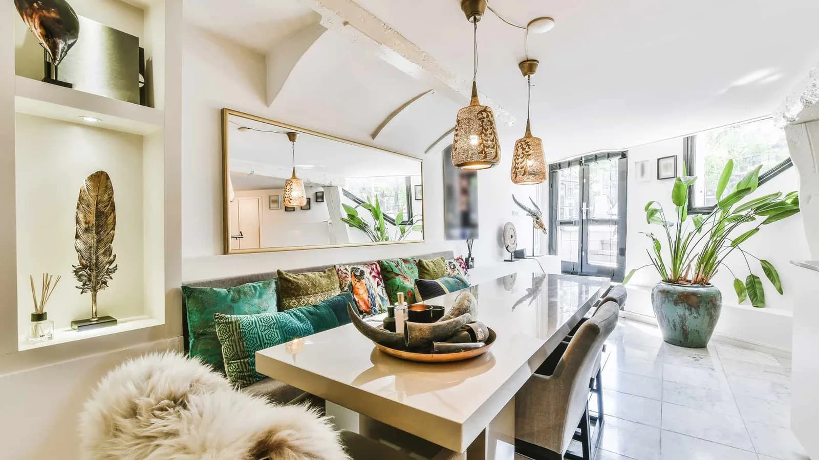 Mirror and task lights above dining table