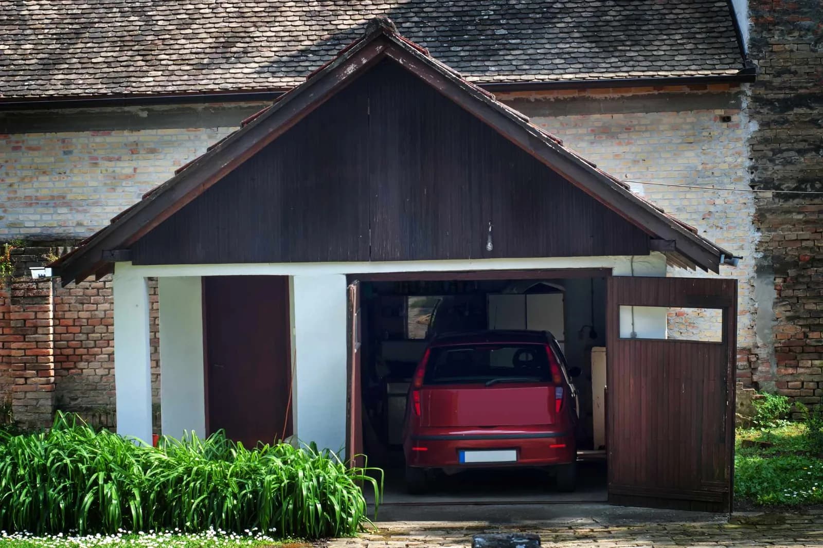 one car garage with a car in it