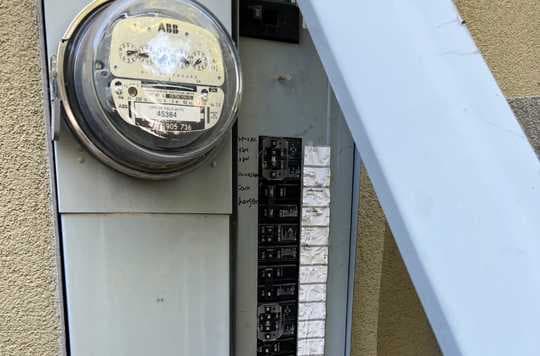 Electrical panel showing meter and breakers