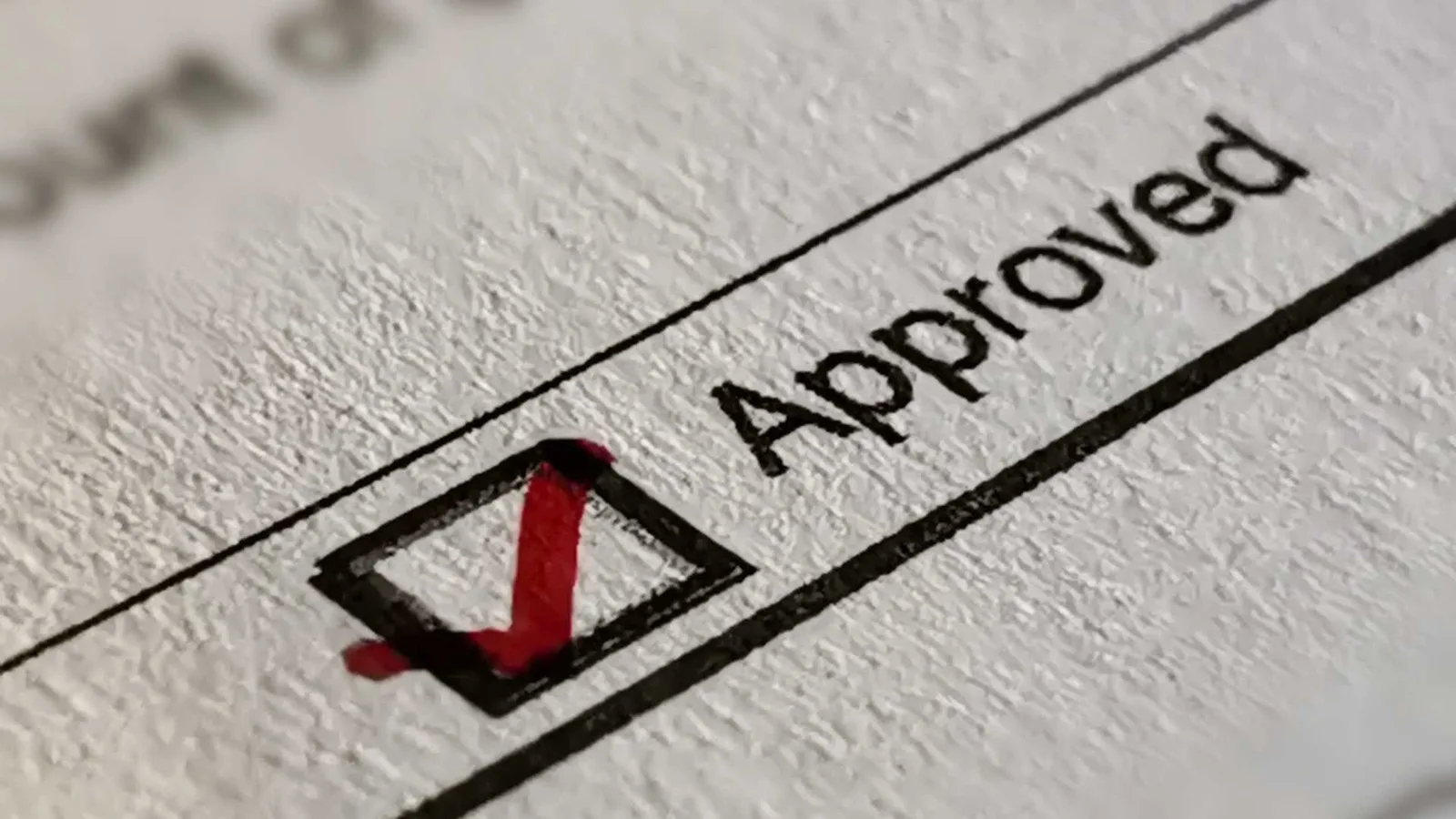 Preapproved ADU plan illustration — the word "approved" with a green checkmark