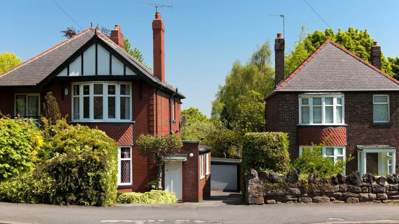 Row of red brick carriage houses converted into homes