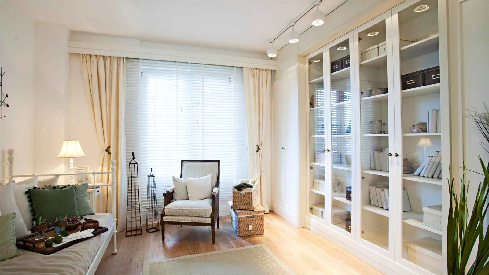 small sitting room with glass door storage