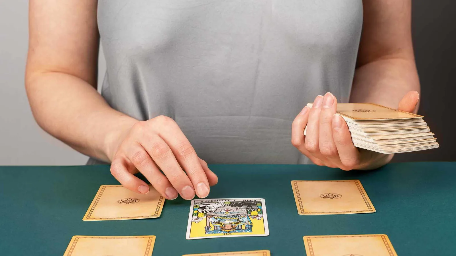 spreading tarot cards on the table