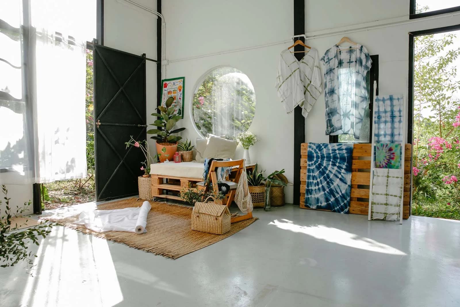 Tailor sewing fabric at an atelier workbench