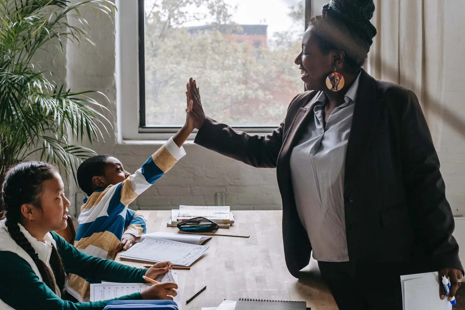 Private tutoring session with student and teacher at a desk