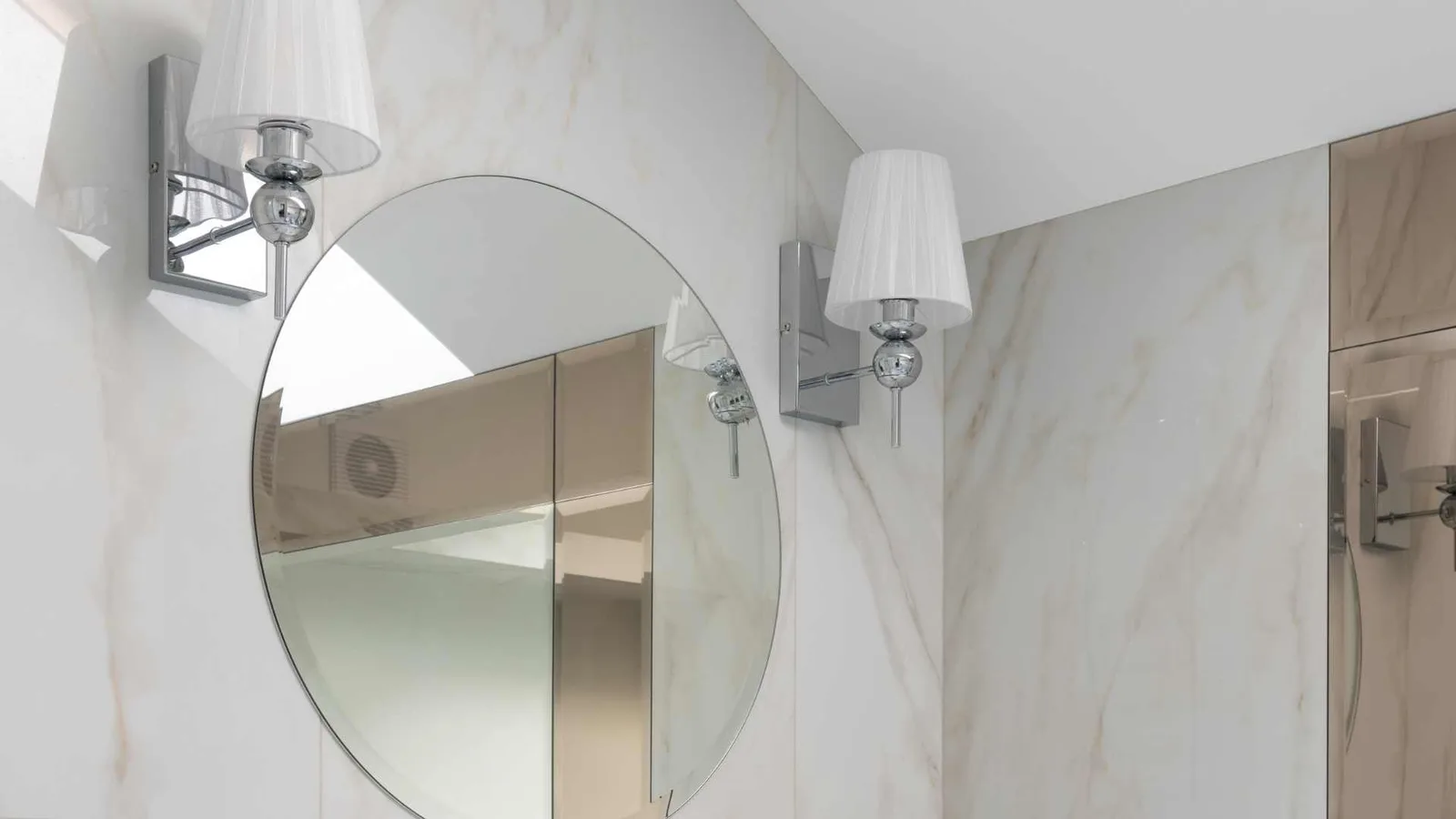Two vanity lights above a bathroom sink