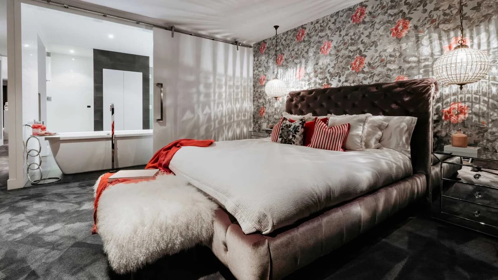 Wallpaper accent wall behind the bed
