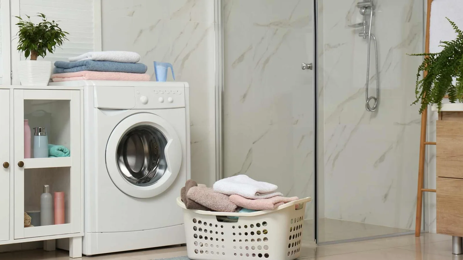 Washer installed beside a bathroom shower
