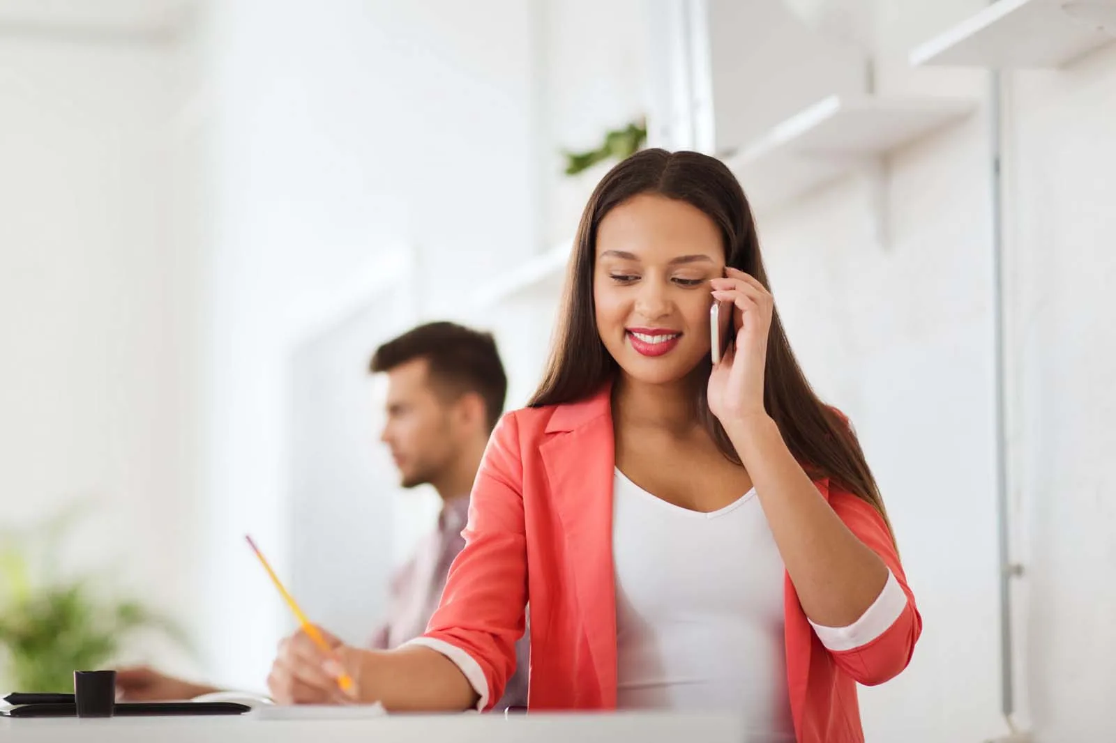 A woman calling on a mobile phone to discuss a contractor project